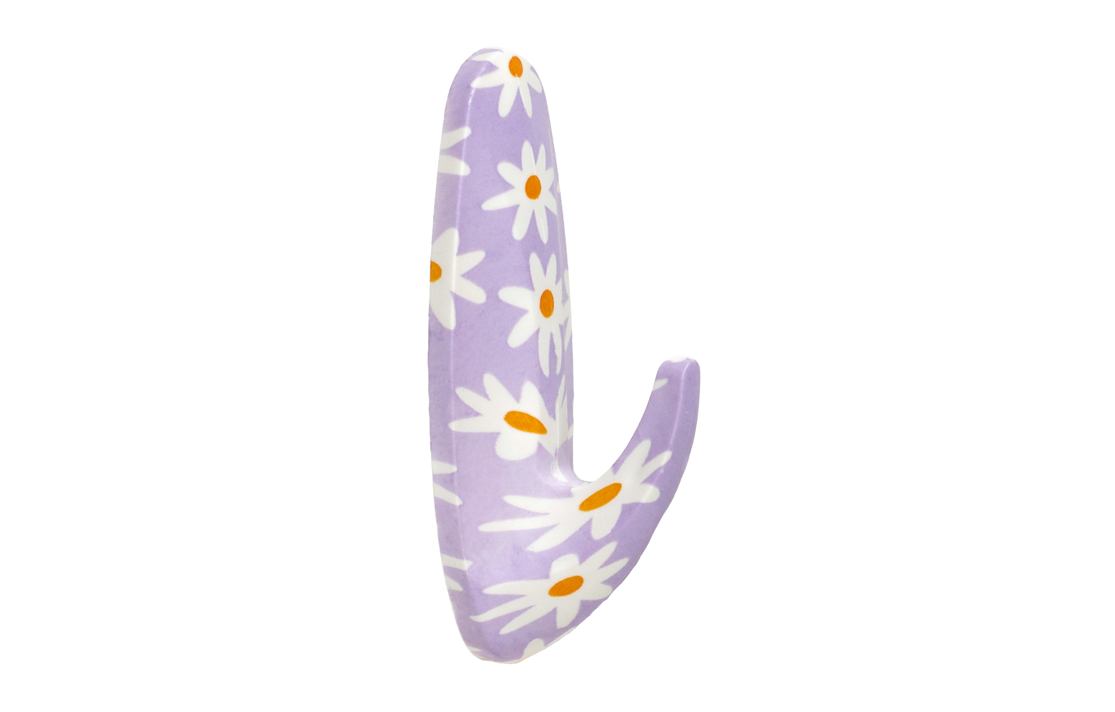 Purple toy with white daisy patterns on a white background