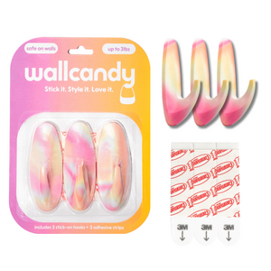 Wallcandy product packaging with pink and white hair clips and adhesive strips.