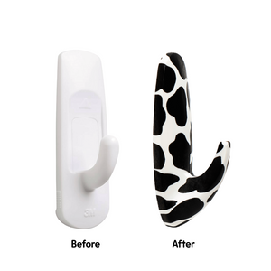 Before and after comparison of a white hook with a cow print design on a white background.