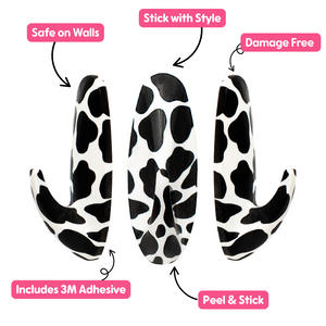 WallCandy Cow Print adhesive wall hooks with 3M strips, peel-and-stick design, safe on walls and damage-free.