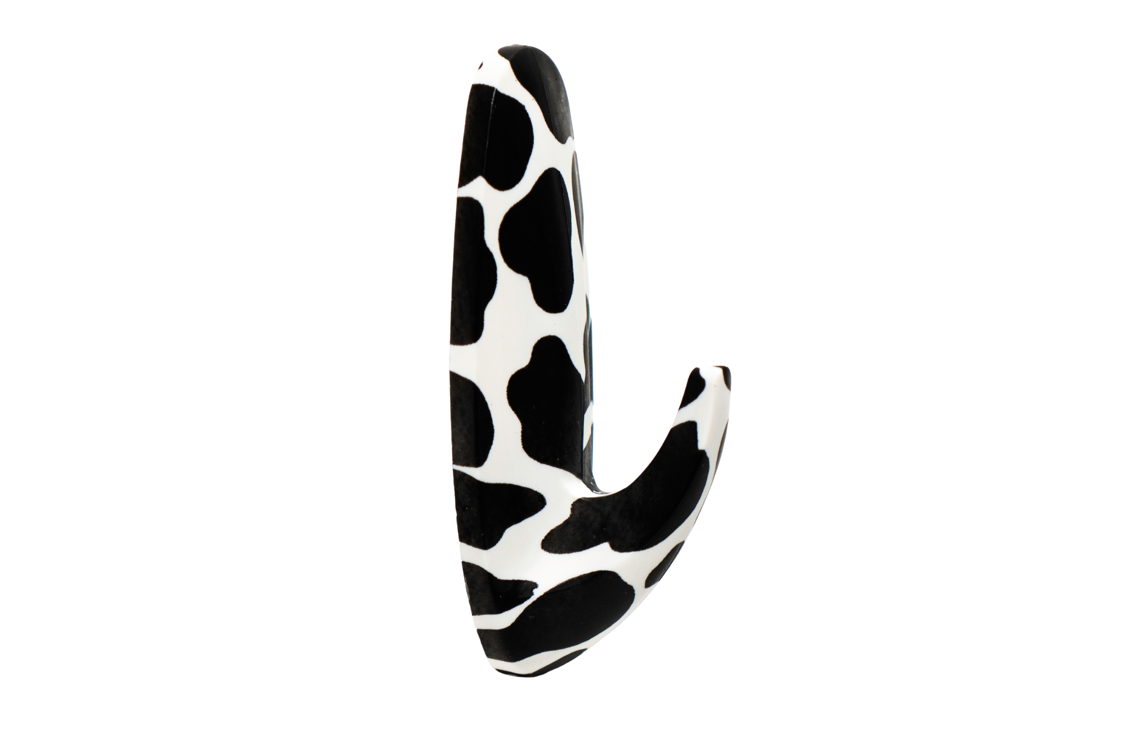 Black and white cow print object on a white background
