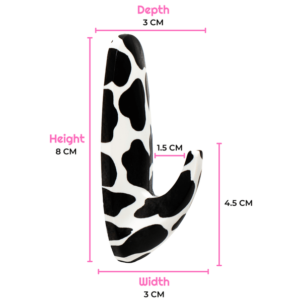 Black and white cow print product with measurements on a white background