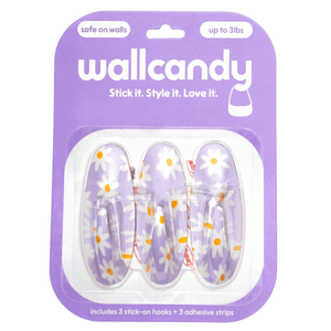 Packaging of wallcandy hooks with floral design on a white background