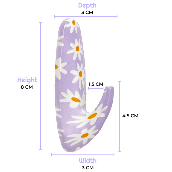 Measurement chart of a purple object with white floral patterns on a white background